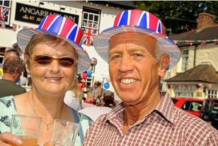 Fran Ridgway, left, and Gordon Gridley raise a glass to the Queen at the Angarrack jubilee party.